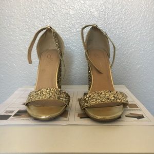 Super comfy sparkly gold high heels, with straps.